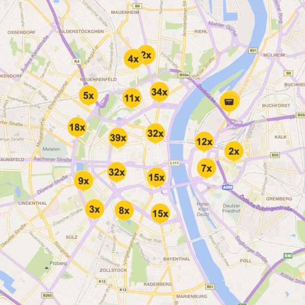 Digitale Stadtkarte mit markierten DHL-Standorten, dargestellt durch gelbe Kreise mit Zahlen, die die Anzahl der Filialen oder Packstationen angeben.